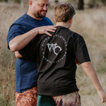Moss green men's footy shorts worn showing relaxed casual country fit