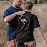Moss green men's footy shorts worn showing relaxed casual country fit