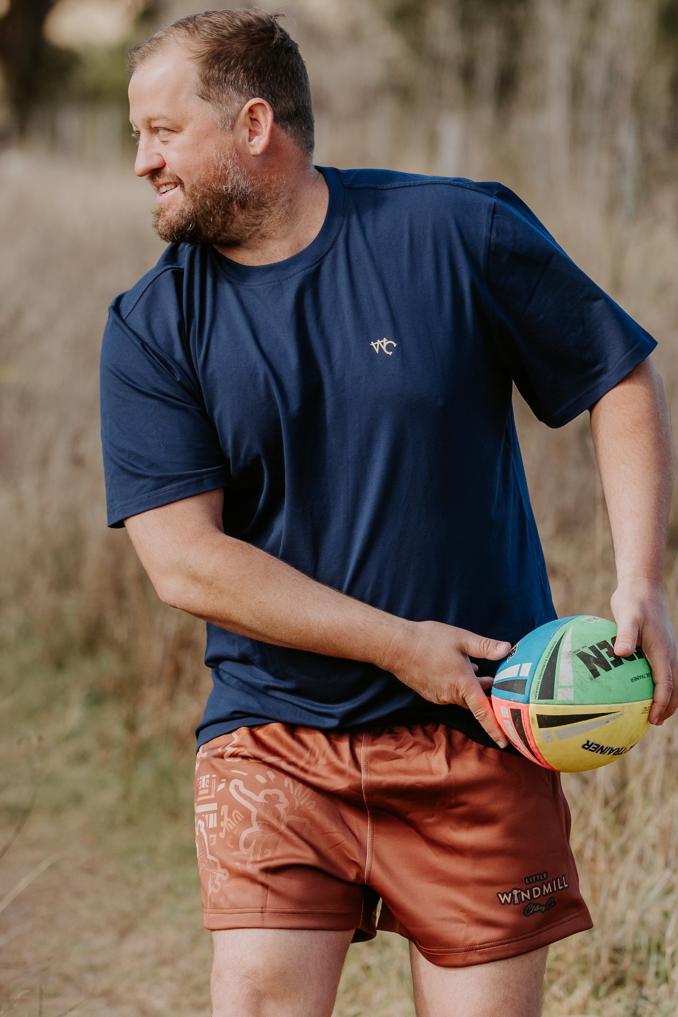 Dust scene bull footy shorts back view showing elastic waistband and full dust scene print