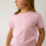 LIMITED EDITION embroidered kids tee soft pink worn by child showing boutique quality and sweet pink style