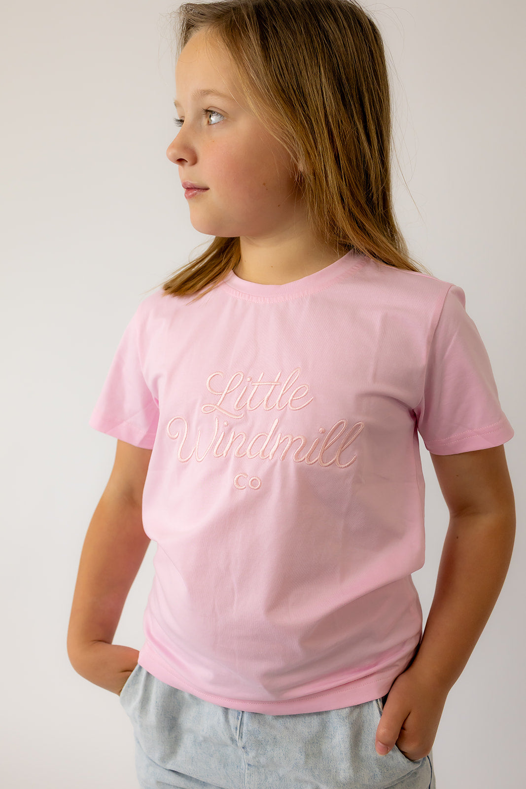 LIMITED EDITION embroidered kids tee soft pink worn by child showing boutique quality and sweet pink style