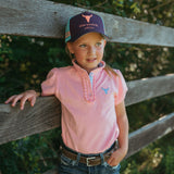 Keira baby pink ruffle polo worn by woman showing beautiful country feminine style