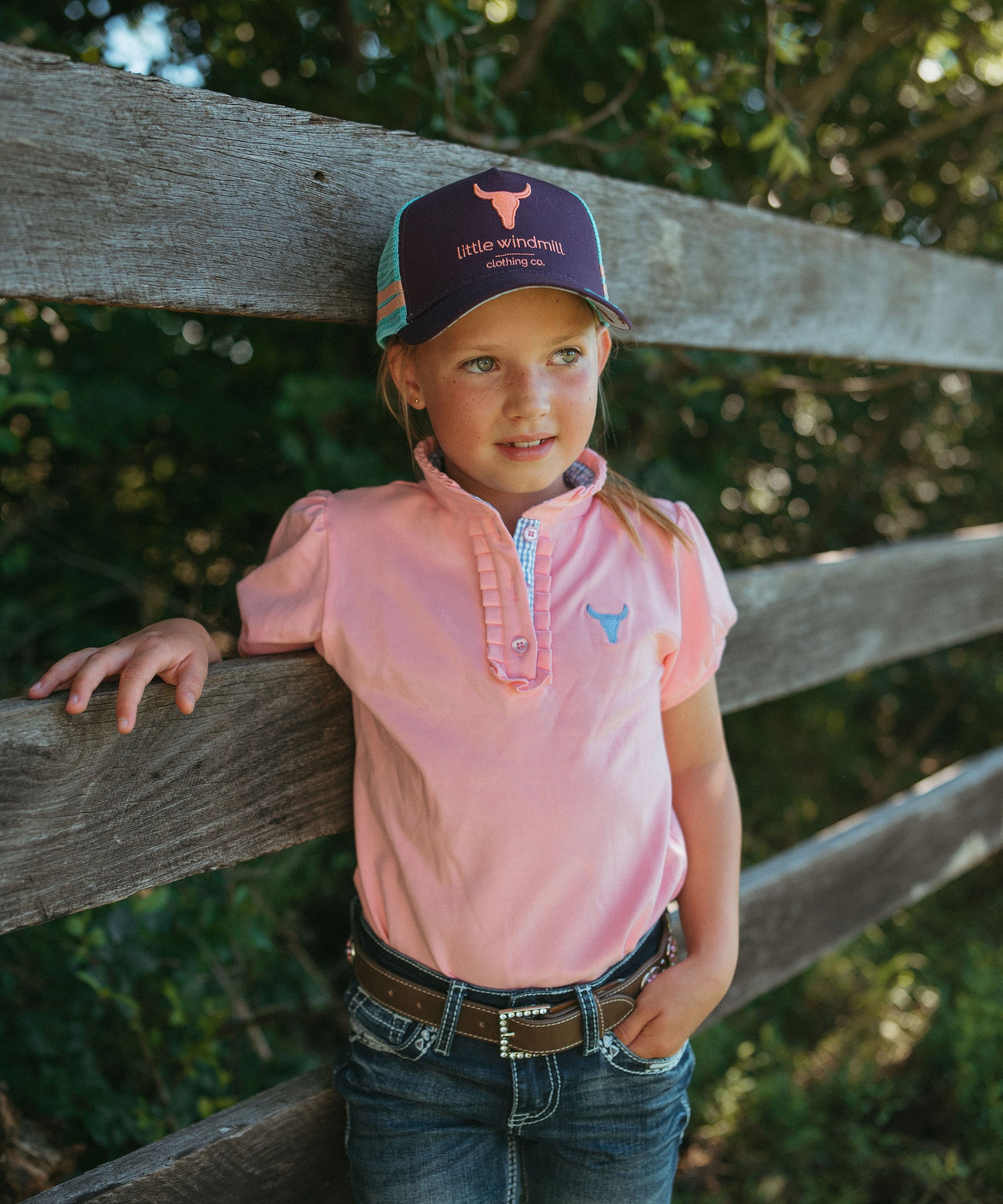 Keira baby pink ruffle polo worn by woman showing beautiful country feminine style