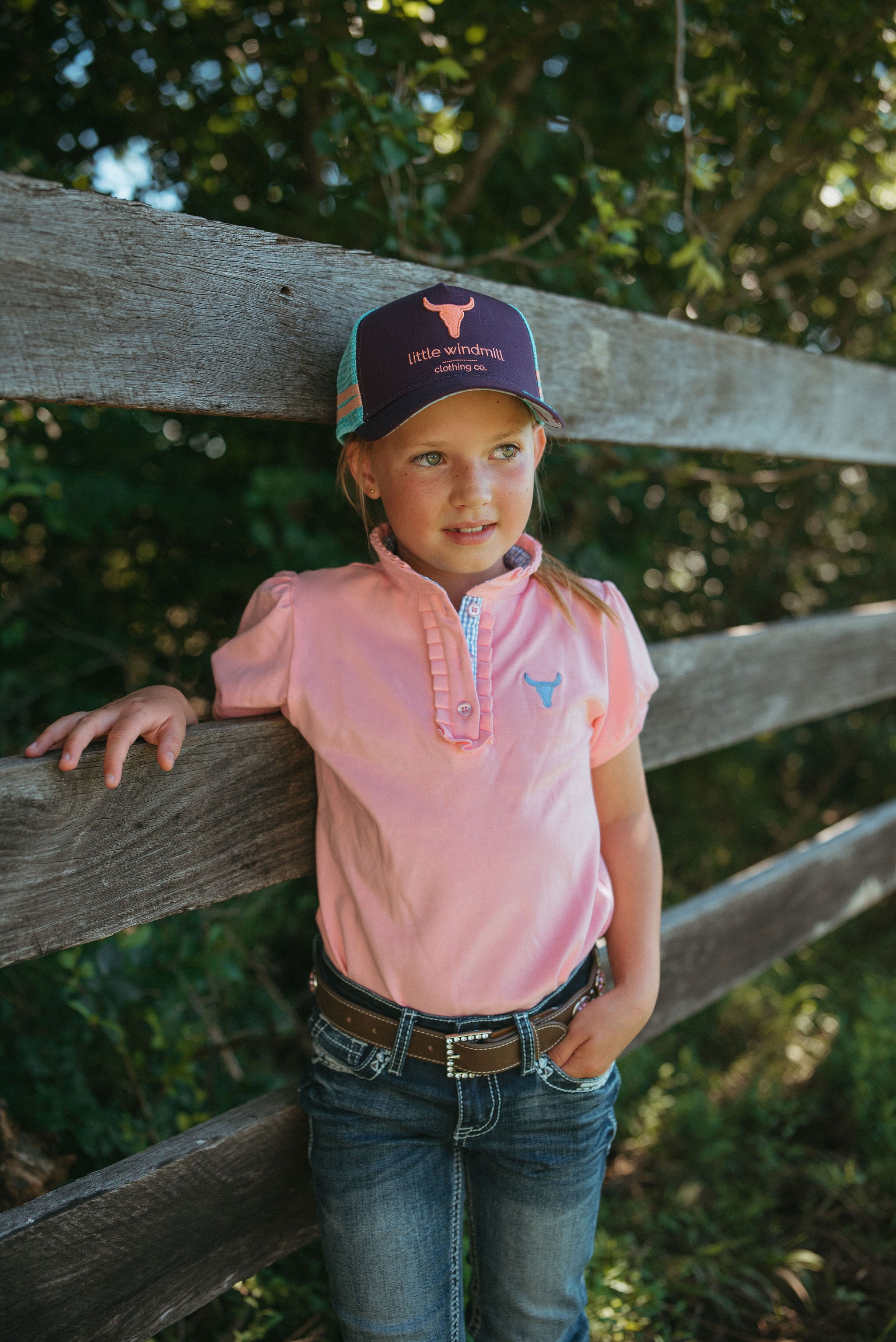 Keira baby pink ruffle polo worn by woman showing beautiful country feminine style