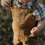 Blaze brown overalls strap detail showing adjustable buckle hardware
