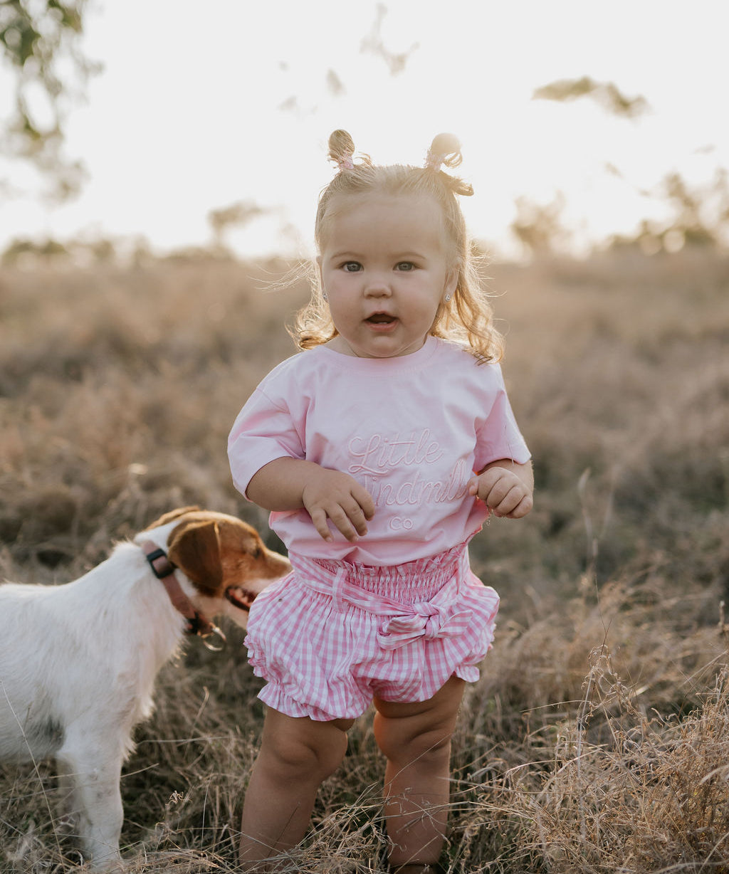Rhiannon pink gingham baby bloomers worn by baby showing adorable pink gingham country style