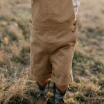 Blaze brown overalls back view showing adjustable strap and quality brown denim