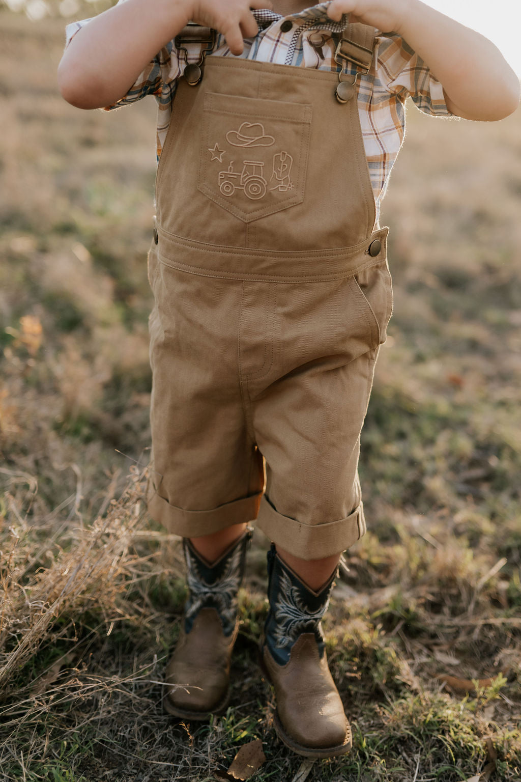 Blaze brown overalls back view showing adjustable strap and quality brown denim