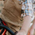 Blaze brown overalls fabric close-up showing quality brown denim weave and finish