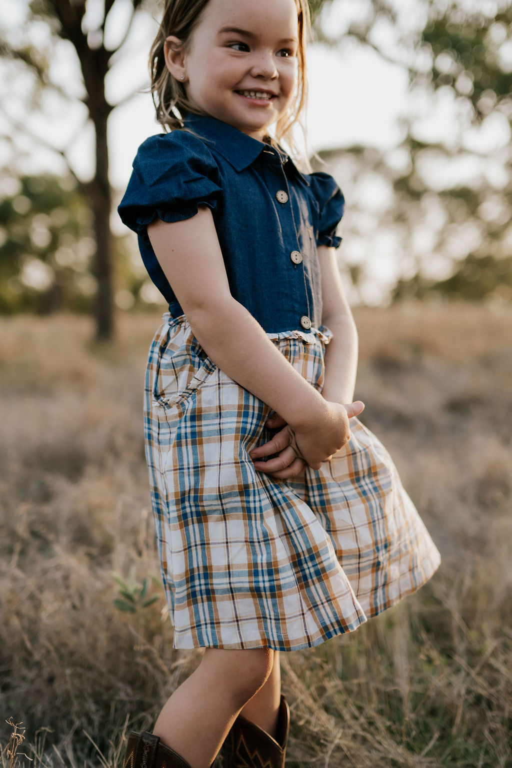 Georgia dark denim check swing dress flatlay showing full A-line swing design in dark denim check