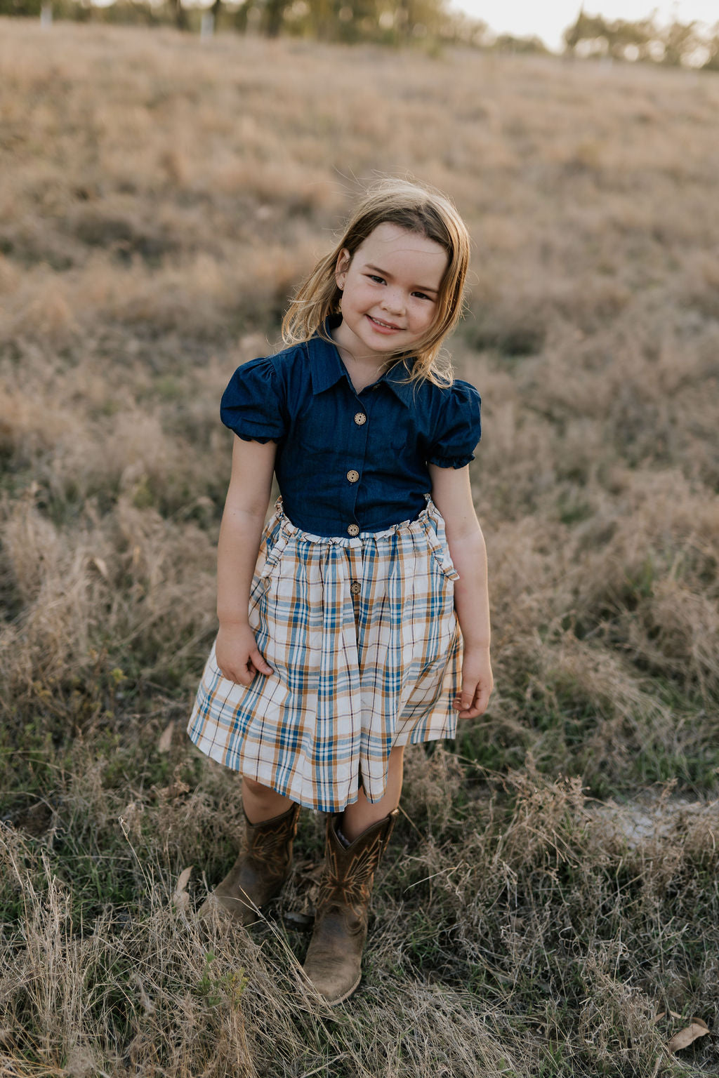 Georgia dark denim check swing dress front view showing charming dark denim check girls swing dress
