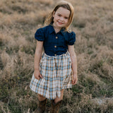 Georgia dark denim check swing dress front view showing charming dark denim check girls swing dress