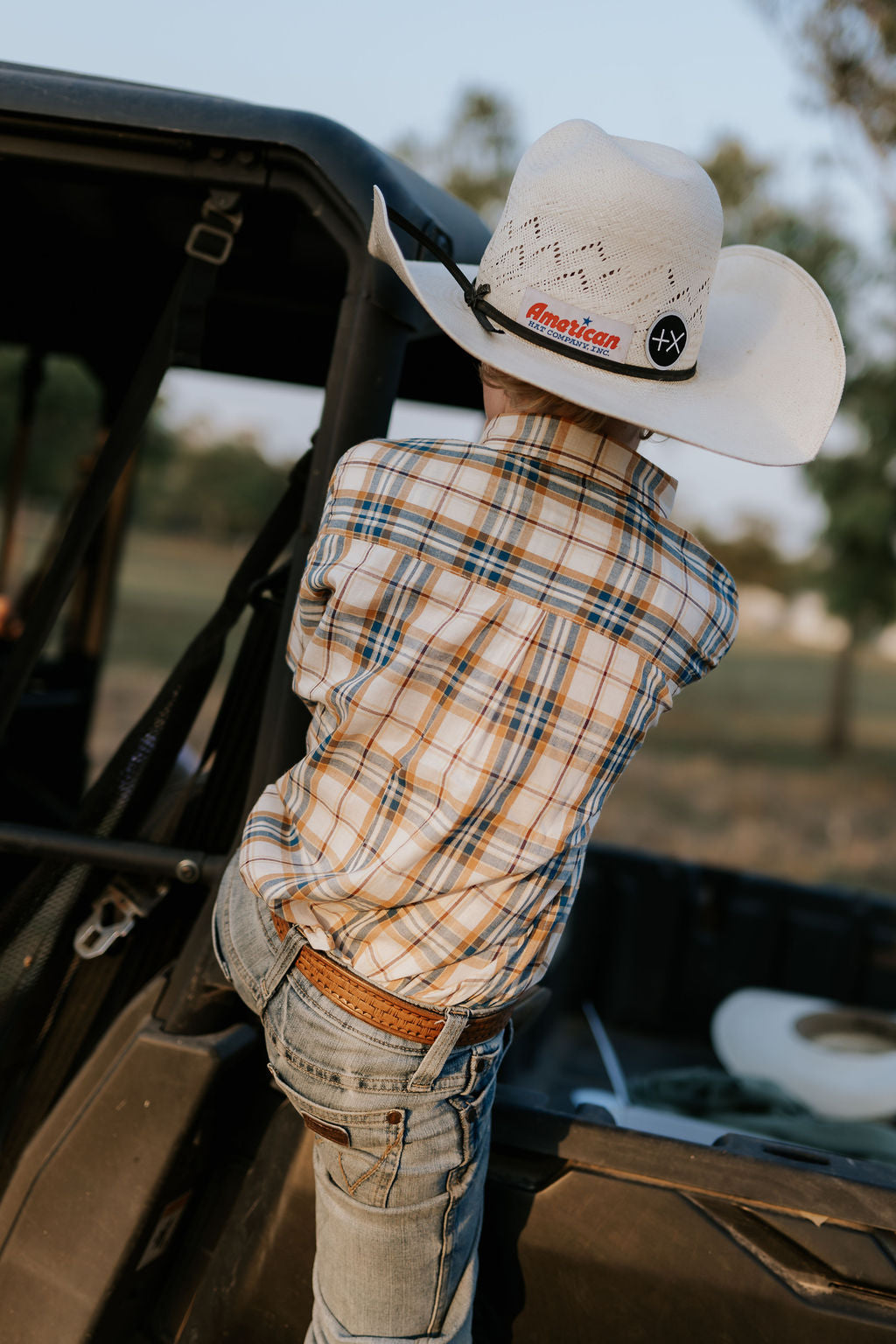 Austin checked tan short sleeve shirt worn by boy showing smart country casual tan check style