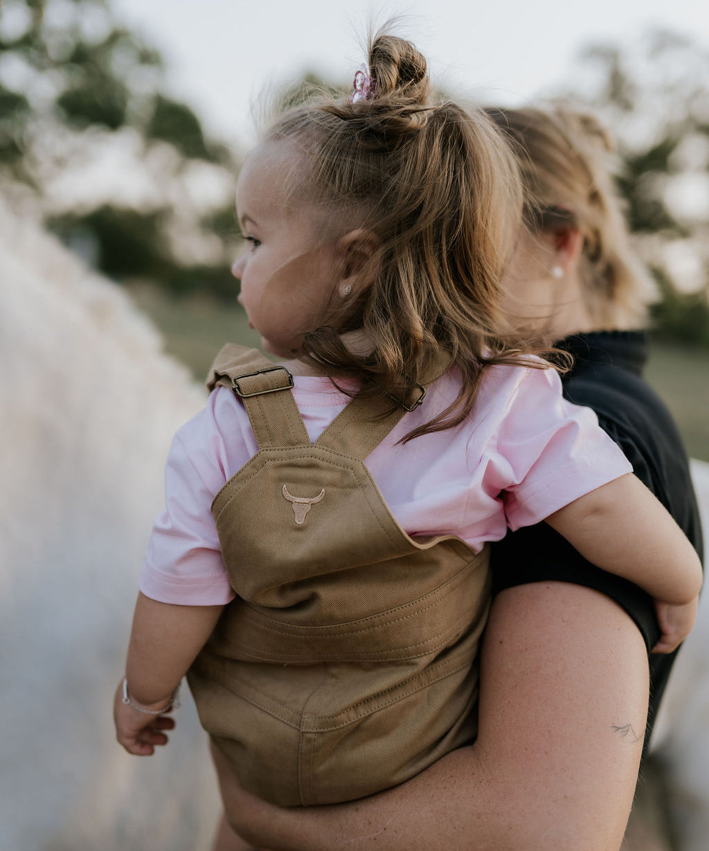 Blaze brown overalls worn by child showing adorable western country style