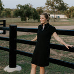 Shay semi-fitted women's black polo dress front view showing sleek black polo neck dress