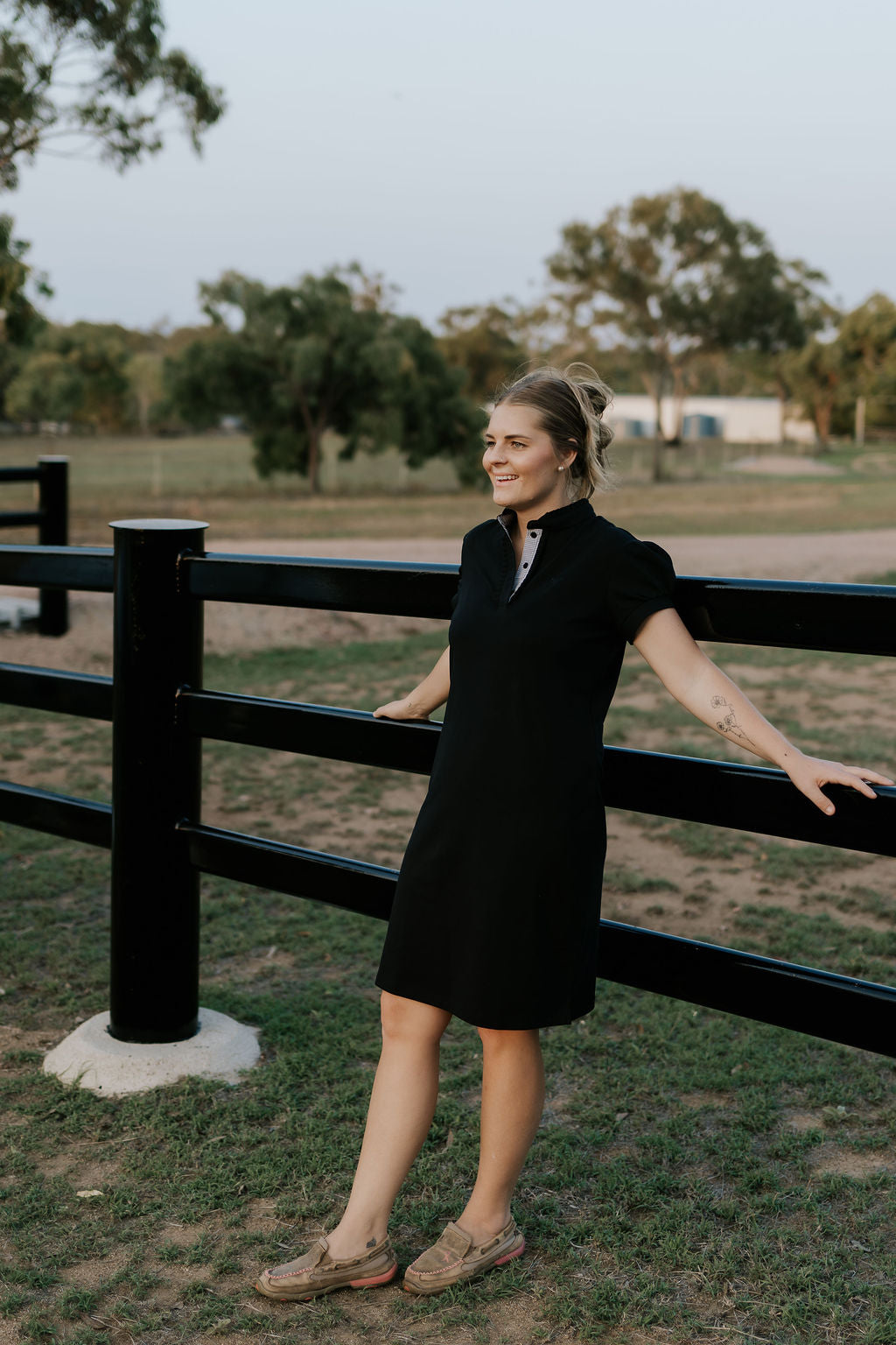 Shay semi-fitted women's black polo dress front view showing sleek black polo neck dress