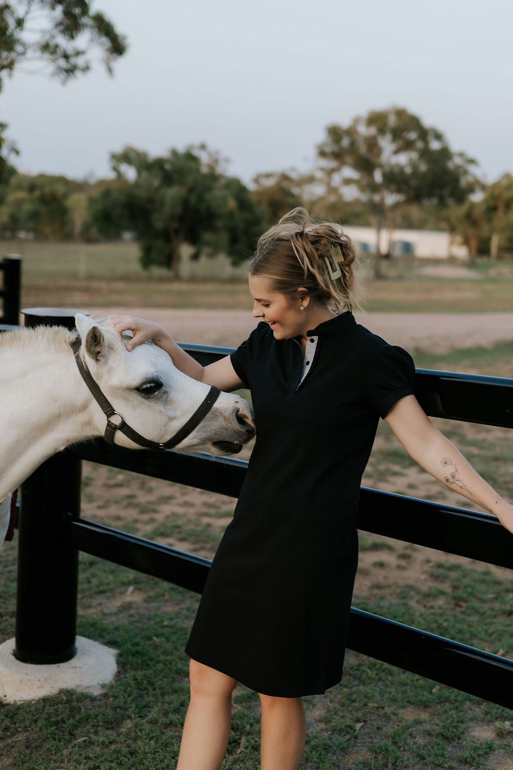 Shay semi-fitted women's black polo dress collar detail showing classic polo neckline in black