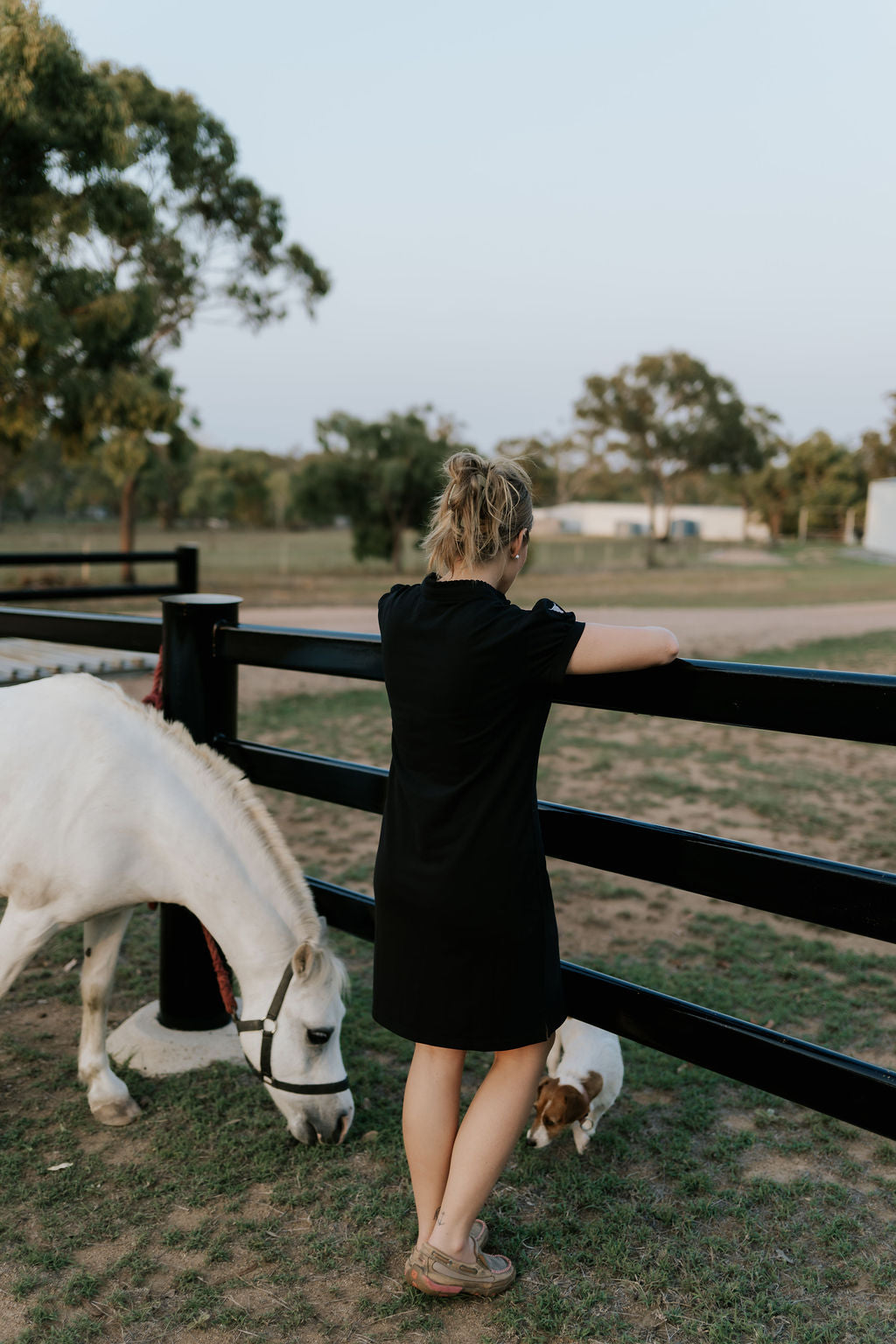 Shay semi-fitted women's black polo dress worn showing polished versatile women's country style
