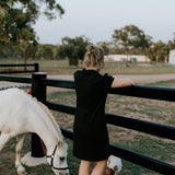 Shay semi-fitted women's black polo dress worn showing polished versatile women's country style