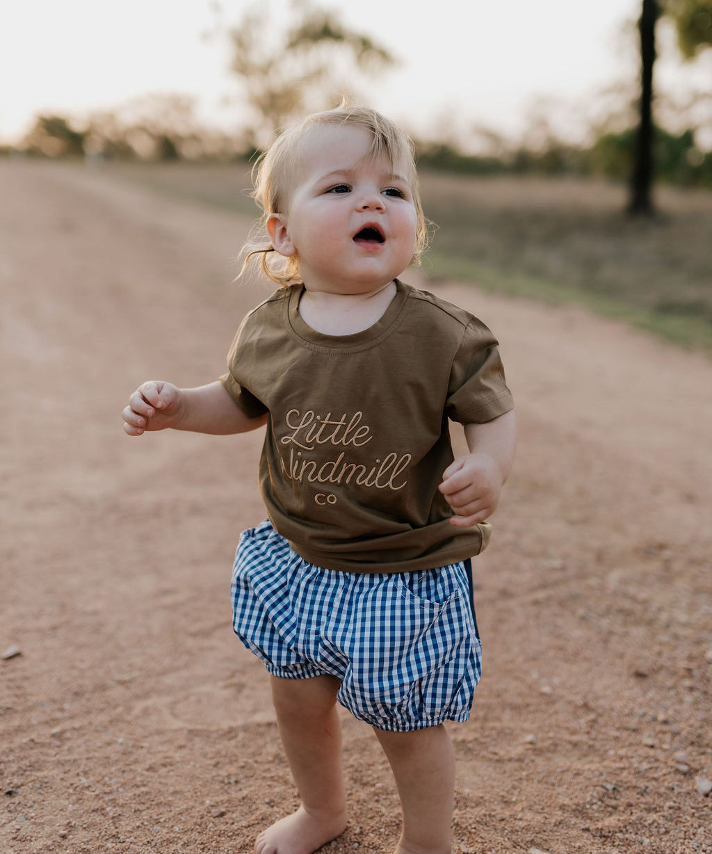 Charlie navy gingham baby bloomers worn by baby showing timeless navy gingham country style