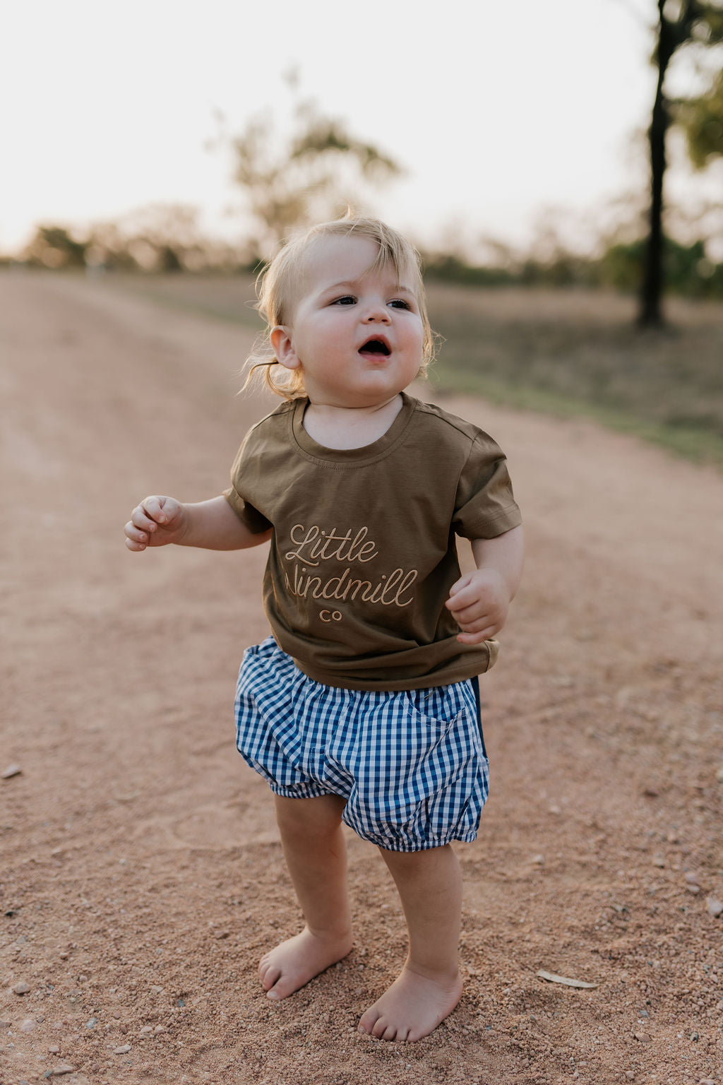 Charlie navy gingham baby bloomers worn by baby showing timeless navy gingham country style