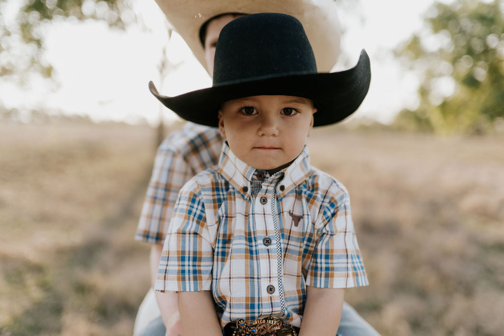 Austin checked tan short sleeve shirt flatlay showing full button-up shirt design in tan check