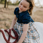 Georgia dark denim check swing dress worn by girl showing sweet country style swing dress