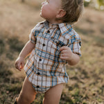 Dallas checked tan short sleeve romper snap detail showing quality press stud closure