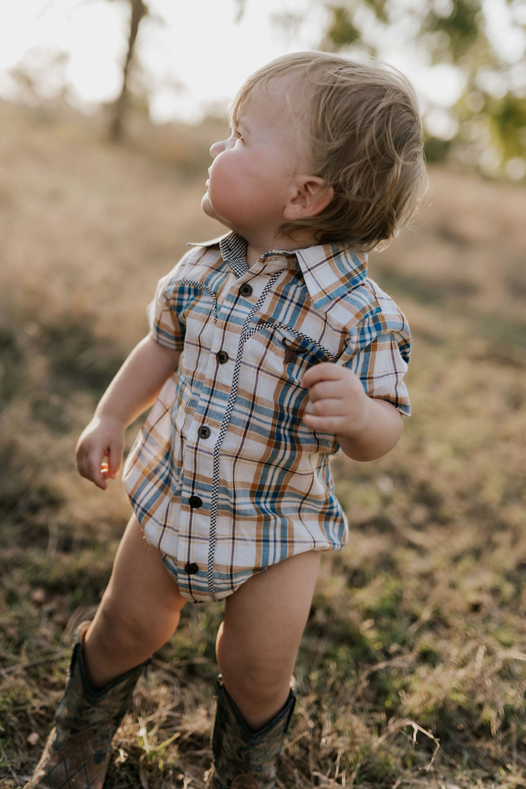 Dallas checked tan short sleeve romper snap detail showing quality press stud closure