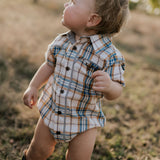 Dallas checked tan short sleeve romper snap detail showing quality press stud closure