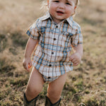 Dallas checked tan short sleeve romper back view showing snap closure and neat tan check fabric