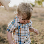 Dallas checked tan short sleeve romper worn by toddler showing sweet western country style