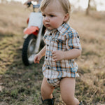 Dallas checked tan short sleeve romper fabric close-up showing quality tan gingham check weave