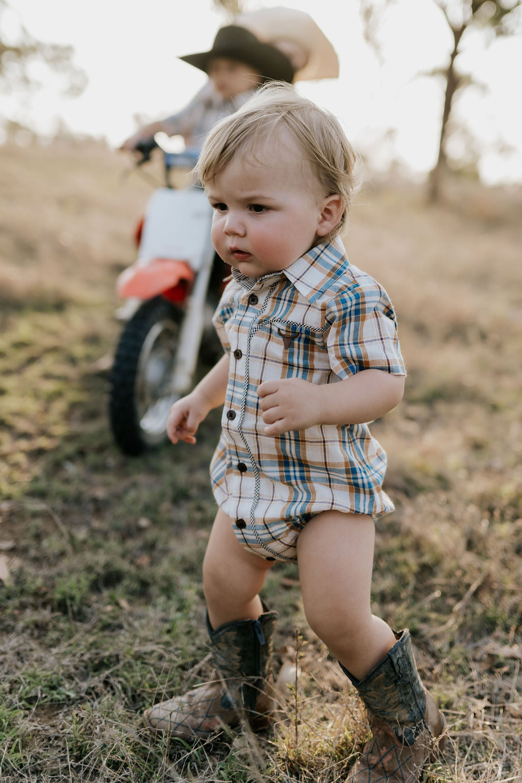 Dallas checked tan short sleeve romper fabric close-up showing quality tan gingham check weave