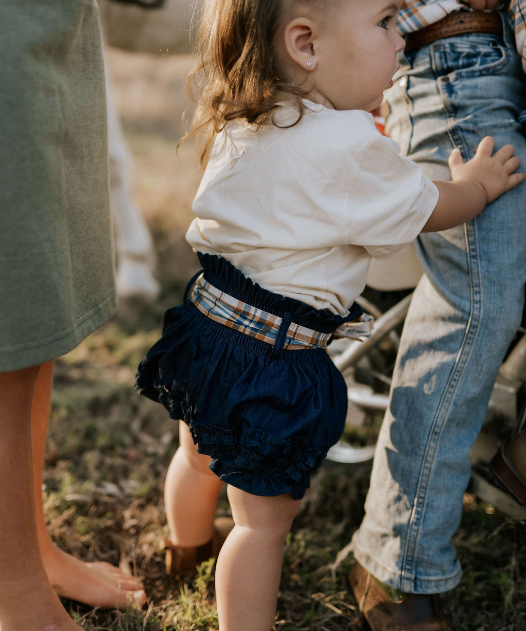 Monica denim baby bloomers with check tie worn by baby showing adorable country style