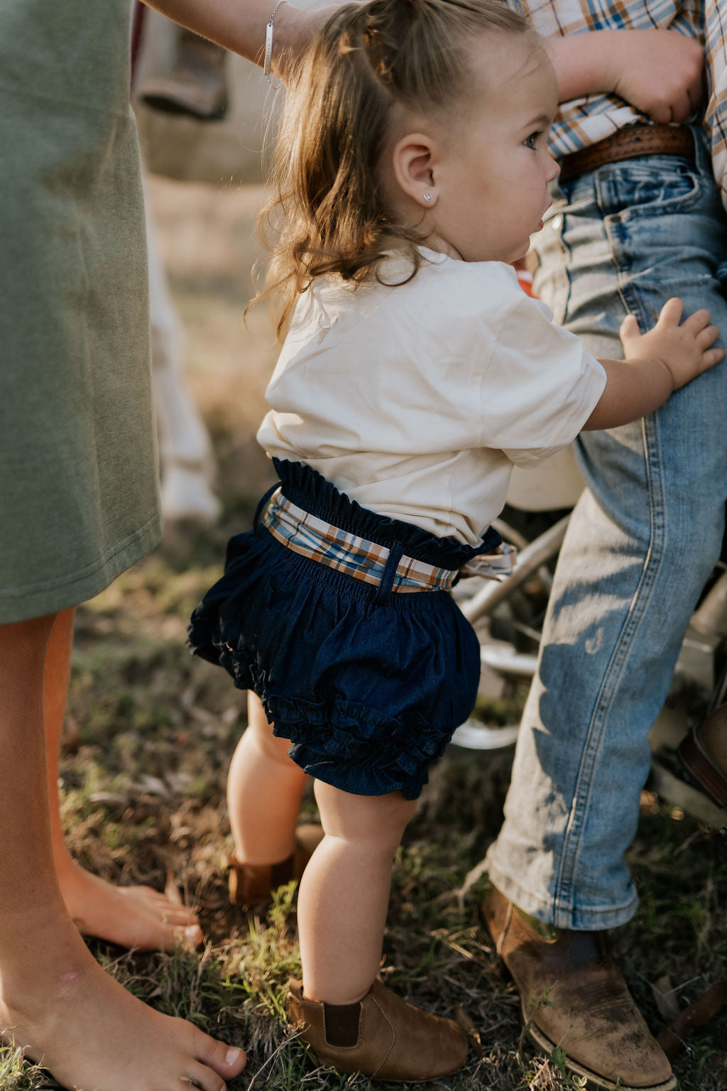 Monica denim baby bloomers with check tie worn by baby showing adorable country style