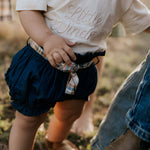 Monica denim baby bloomers with check tie front view showing sweet denim bloomer with gingham check bow
