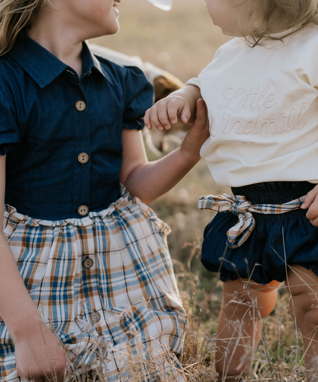 Monica denim baby bloomers with check tie back view showing cute denim style and comfortable fit