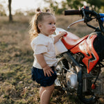 Monica denim baby bloomers with check tie waist detail showing quality elastic waist construction