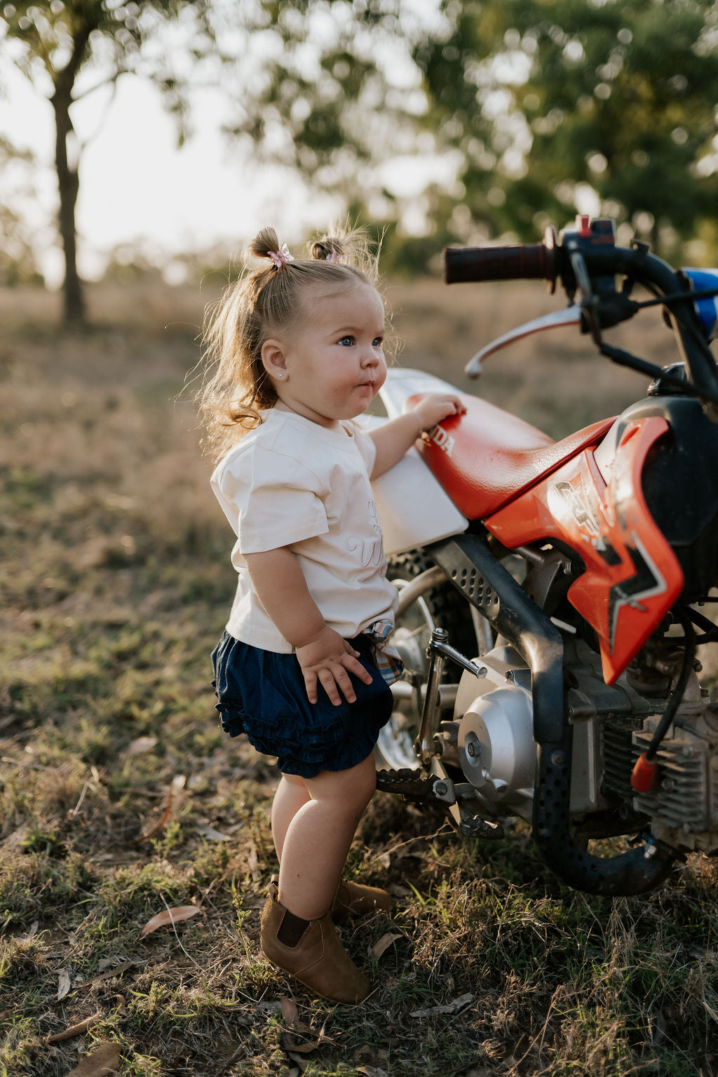 Monica denim baby bloomers with check tie waist detail showing quality elastic waist construction