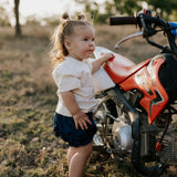 Monica denim baby bloomers with check tie waist detail showing quality elastic waist construction