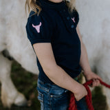 Leah classic navy ruffle polo worn by woman showing timeless country elegant style