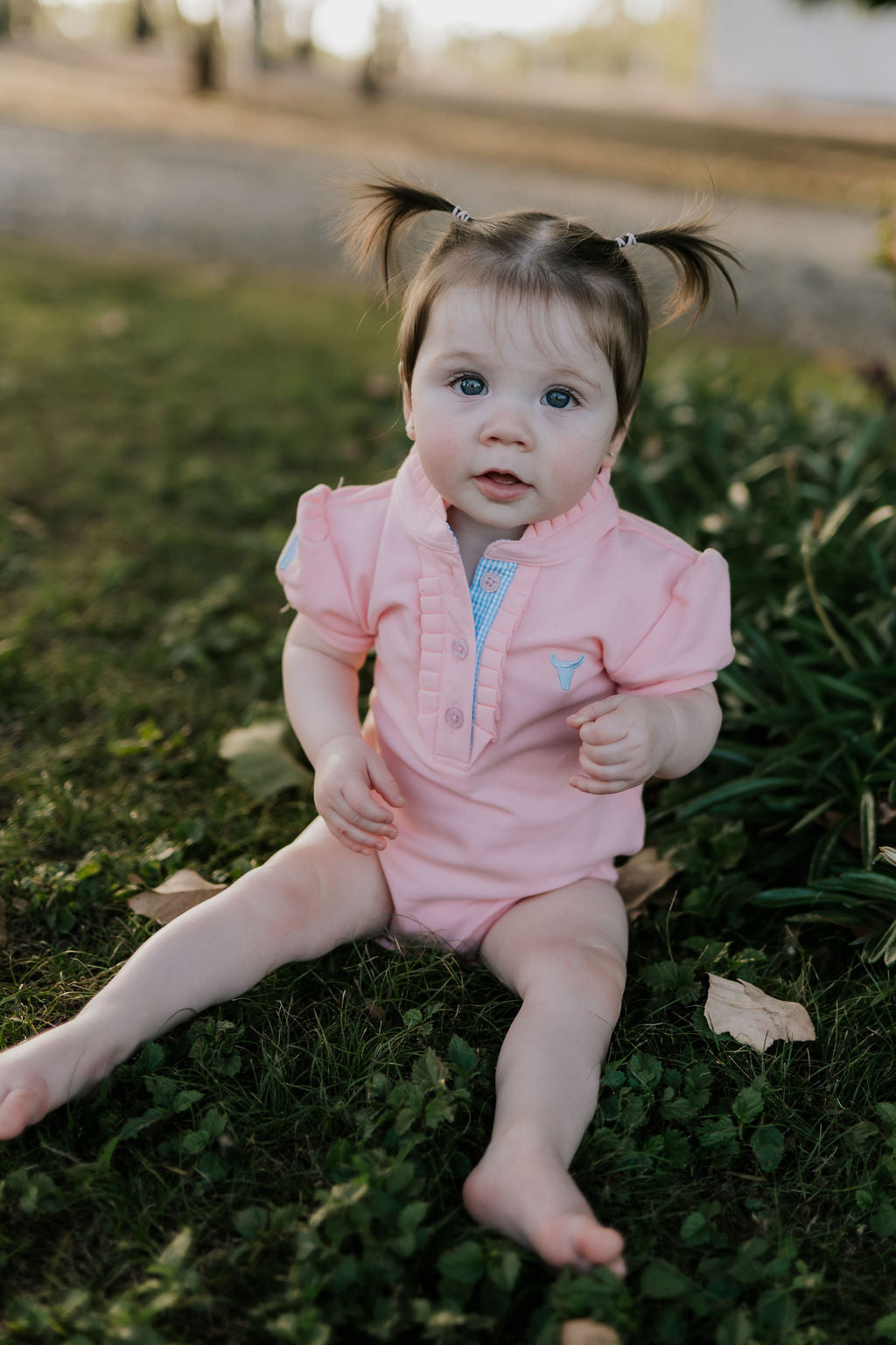 Kiki Baby baby pink polo romper flat lay showing full design for newborn to 24 months