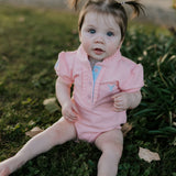 Kiki Baby baby pink polo romper flat lay showing full design for newborn to 24 months