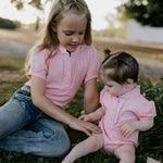 Kiki Baby pink polo romper collar and button detail close-up showing quality construction