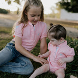 Kiki Baby pink polo romper collar and button detail close-up showing quality construction