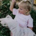 LIMITED EDITION embroidered kids tee soft pink flat lay showing full design