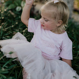 LIMITED EDITION embroidered kids tee soft pink flat lay showing full design