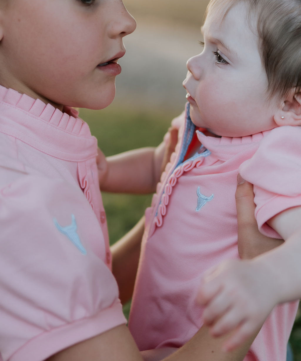 Kiki Baby baby pink polo romper worn by baby showing sweet country style