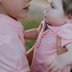 Kiki Baby baby pink polo romper worn by baby showing sweet country style